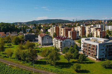 Fototapeta premium An aerial view over a residential district of Karlovac, south of the historic centre, in Central Croatia. The city railway line is in the foreground