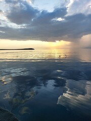 Summer sunset on the lake.mirror image,lake surface,calm.