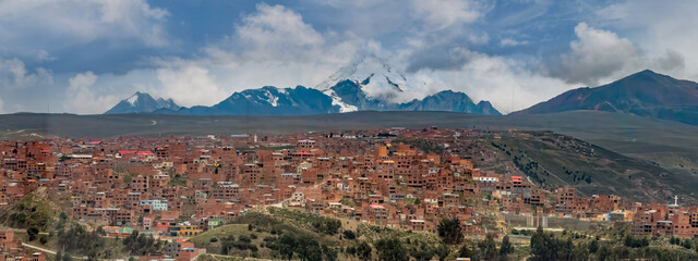 Huayna Potosí mountain as seen from El Alto, La Paz, Bolivia. With an elevation of 6,088 m (ca. 20,000 feet), - obrazy, fototapety, plakaty