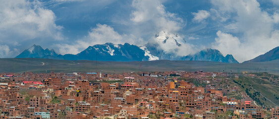 Fototapeta premium Huayna Potosí mountain as seen from El Alto, La Paz, Bolivia. With an elevation of 6,088 m (ca. 20,000 feet),