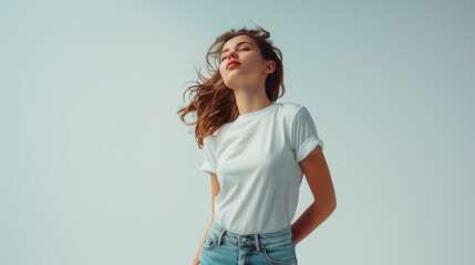 White T-Shirt Mockup: Youthful Fair-Skinned Woman with Dark Hair and Wind-Blown Tresses in Denim Jeans, Capturing Youth and Fashion