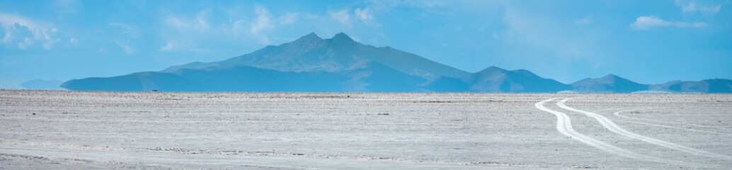 Off road driving on solid salt expanses on the Salar de Uyuni, the world's largest salt flat,...