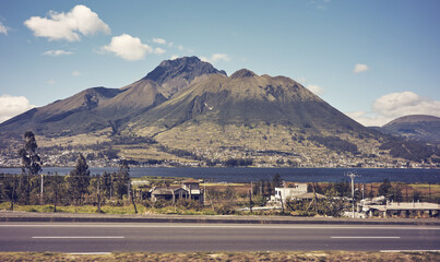 Rural landscape seen from a road, color toned photo, Ecuador.