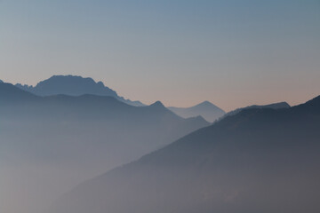 Spectacular mountain ranges silhouettes in morning.