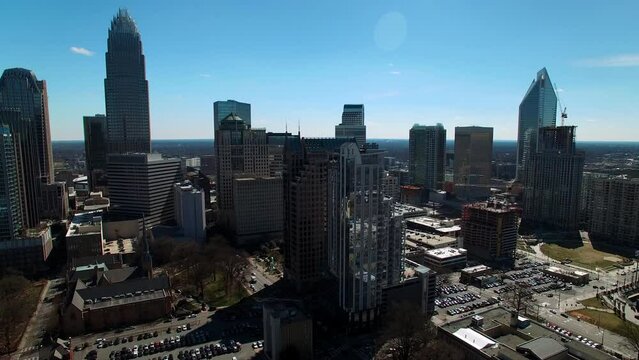 Aerial Panning Shot Of Modern Office Buildings In Financial District Against Sky On Sunny Day - Charlotte, North Carolina