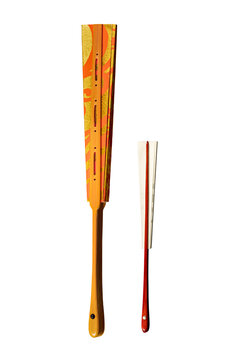 Japanese traditional closed fans from paper and lacquered bamboo with gold, red and white ornament
