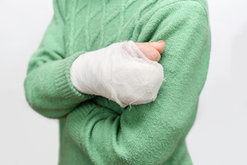 An elderly woman accidentally fell on the street because it was slippery and broke right arm, now she wears a cast and tries to be careful, medical concept