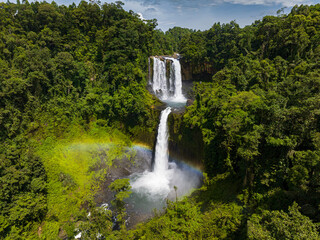Tropical landscape with beautiful water splash from Limunsudan Falls. Mindanao, Philippines.