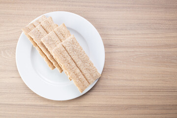 Buckwheat crisp bread texture on wooden background, Dietary cookies.