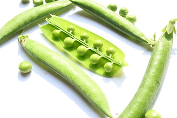 Fresh green pea on white background. There is a lot of vitamins  and Minerals in it. The pea is...