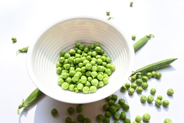 Fresh green pea on white background. There is a lot of vitamins  and Minerals in it. The pea is...