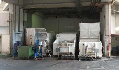 Waste management and recycling equipment installed inside a shopping mall. Shopping malls have a...
