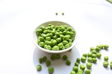 Fresh green pea on white background. There is a lot of vitamins  and Minerals in it. The pea is most commonly the small spherical seed or the seed. Popular vegetable of all over world. 
