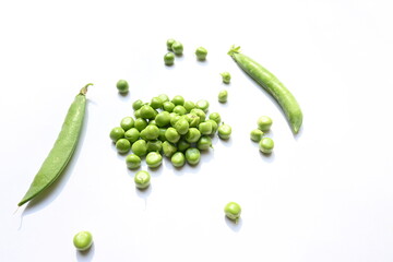 Fresh green pea on white background. There is a lot of vitamins  and Minerals in it. The pea is most commonly the small spherical seed or the seed. Popular vegetable of all over world. 