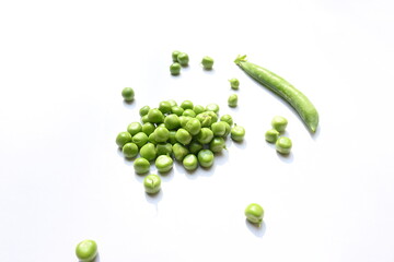 Fresh green pea on white background. There is a lot of vitamins  and Minerals in it. The pea is most commonly the small spherical seed or the seed. Popular vegetable of all over world. 