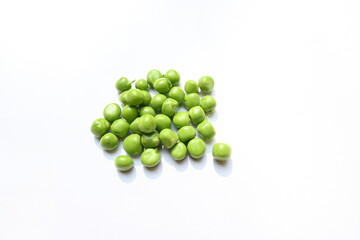 Fresh green pea on white background. There is a lot of vitamins  and Minerals in it. The pea is most commonly the small spherical seed or the seed. Popular vegetable of all over world. 