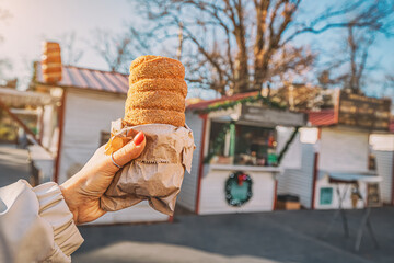 biting into a warm trdelnik, its crispy exterior giving way to a soft, doughy center infused with...