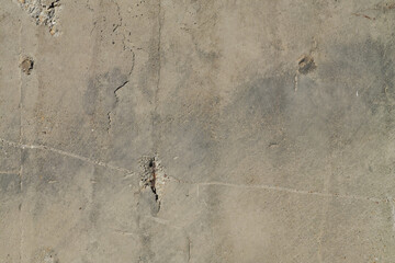 Rough concrete wall with notable horizontal scratch and few holes - obrazy, fototapety, plakaty