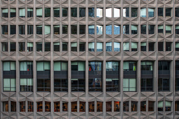 Fototapeta na wymiar Texture of a modern building with glass façades in the 