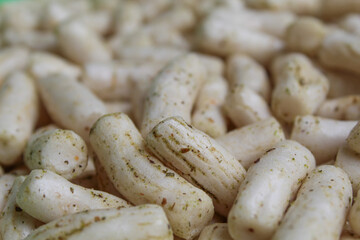 Fish crackers in small cylinder shape. Snack from Indonesia, called krupuk ikan tongkol