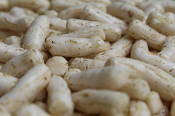 Fish crackers in small cylinder shape. Snack from Indonesia, called krupuk ikan tongkol