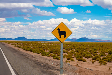 Llama crossing sign on the road Uyuni (Potosi, Bolivia) to Calama (Antofagasta, Chile), Bolivia - obrazy, fototapety, plakaty