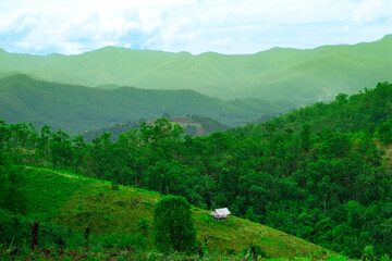 Lonely Hut Amidst the Green Hills of Thailand Rainforest Jungle Country Side - Travel Backpacking Tourism Background 