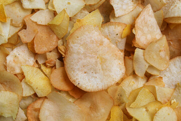 Cassava chips as background, flat lay