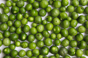 Fruit of Solanum nigrum, the European black nightshade or leunca, flat lay or top view