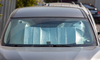 Obraz premium Reflective sun protection on car windshield