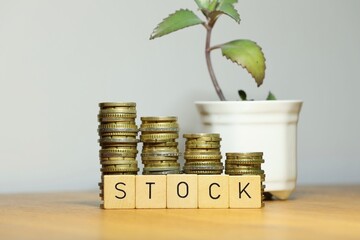 Successful stock trading and potential growth in stock market symbolized by stacked coins and plant