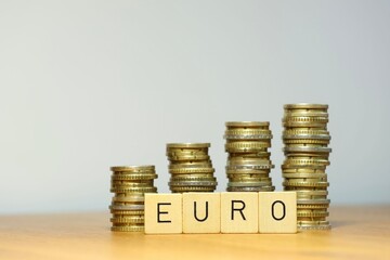 rising euro exchange rate, exchange rate rises, euro gains in value, EU currency symbolized by stacked coins, Stock trade and earning money, higher income and more earnings
