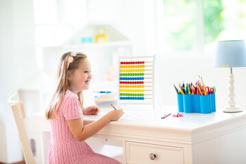 Child drawing. Kids paint. Girl after school.