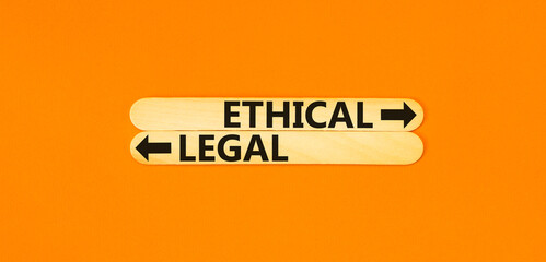 Ethical or legal symbol. Concept word Ethical or Legal on beautiful wooden stick. Beautiful orange table orange background. Business and ethical or legal concept. Copy space.