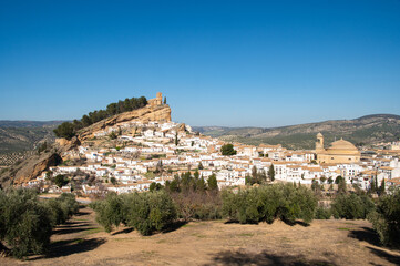 Old town Montefrio. The ruins of a Moorish castle on a rock and white houses under cloudless sky. Pueblos blancos, Andalusia, Spain. - obrazy, fototapety, plakaty
