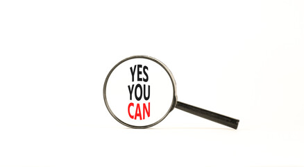 Motivational Yes you can symbol. Concept words Yes you can in beautiful magnifying glass. Beautiful white table white background. Business motivational and Yes you can concept. Copy space
