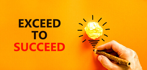 Exceed to succeed symbol. Concept words Exceed to succeed on beautiful orange paper. Beautiful...