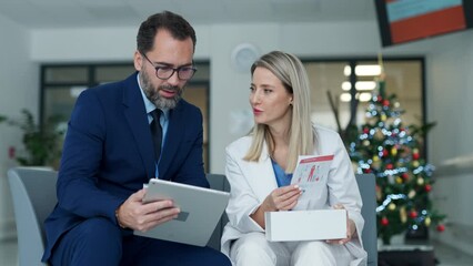Pharmaceutical sales representative talking with doctor in medical building. Female doctor talking with hospital director, manager in private clinic.