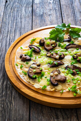 Vietnamese pizza - rice pepper omelet on wooden table