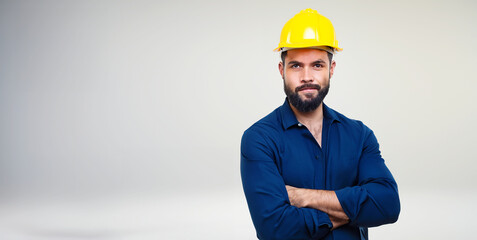 a builder in a construction helmet on a white background