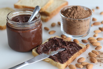 Bread slice with almond chocolate spread, a heavenly blend of rich almonds and smooth chocolate