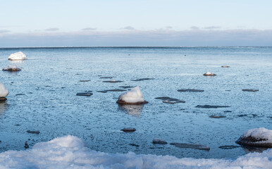 frozen sea nad rocks