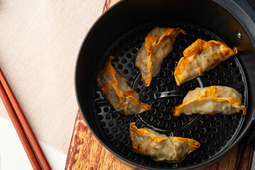 Airfryer gyoza,Use Air Fryer grilled dumplings pork and vegetables.Top view