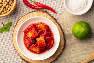 Fermented bean curd in white plate(Red Sufu) ,Chinese Cheese.Top view