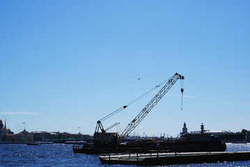 The ship is moored on the waterfront near the shipyard, a cargo ship.