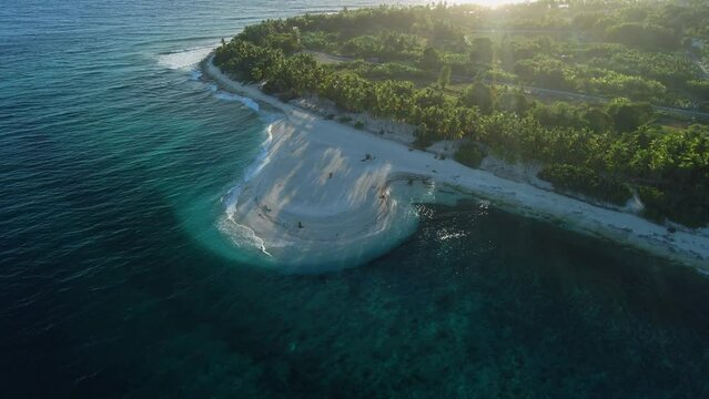 Maldives beach coastline with sunrise sunshine. Aerial view of Fuvahmulah island