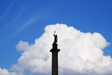 Alexander Column of the Palace Square, Sculpture of anel with a cross against the sky, Historical sculptures. Saint Petersburg.