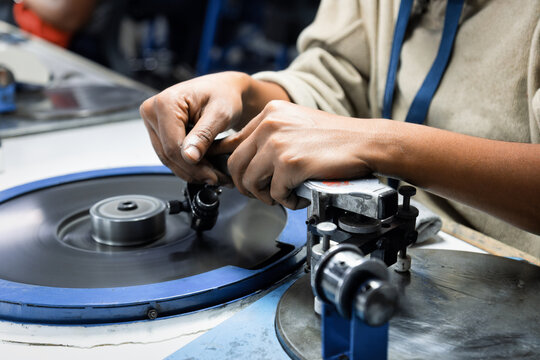 diamond polishers at work at the wheel in the diamond polishing factory
