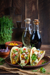 Mexican tacos with chicken meat, corn and salsa. Healthy tacos. Diet menu. Mexican taco.