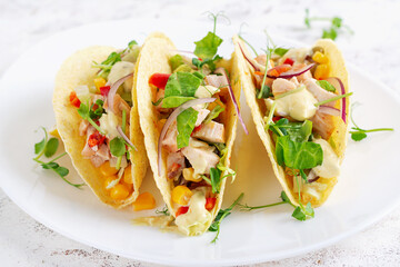 Mexican tacos with chicken meat, corn and salsa. Healthy tacos. Diet menu. Mexican taco.